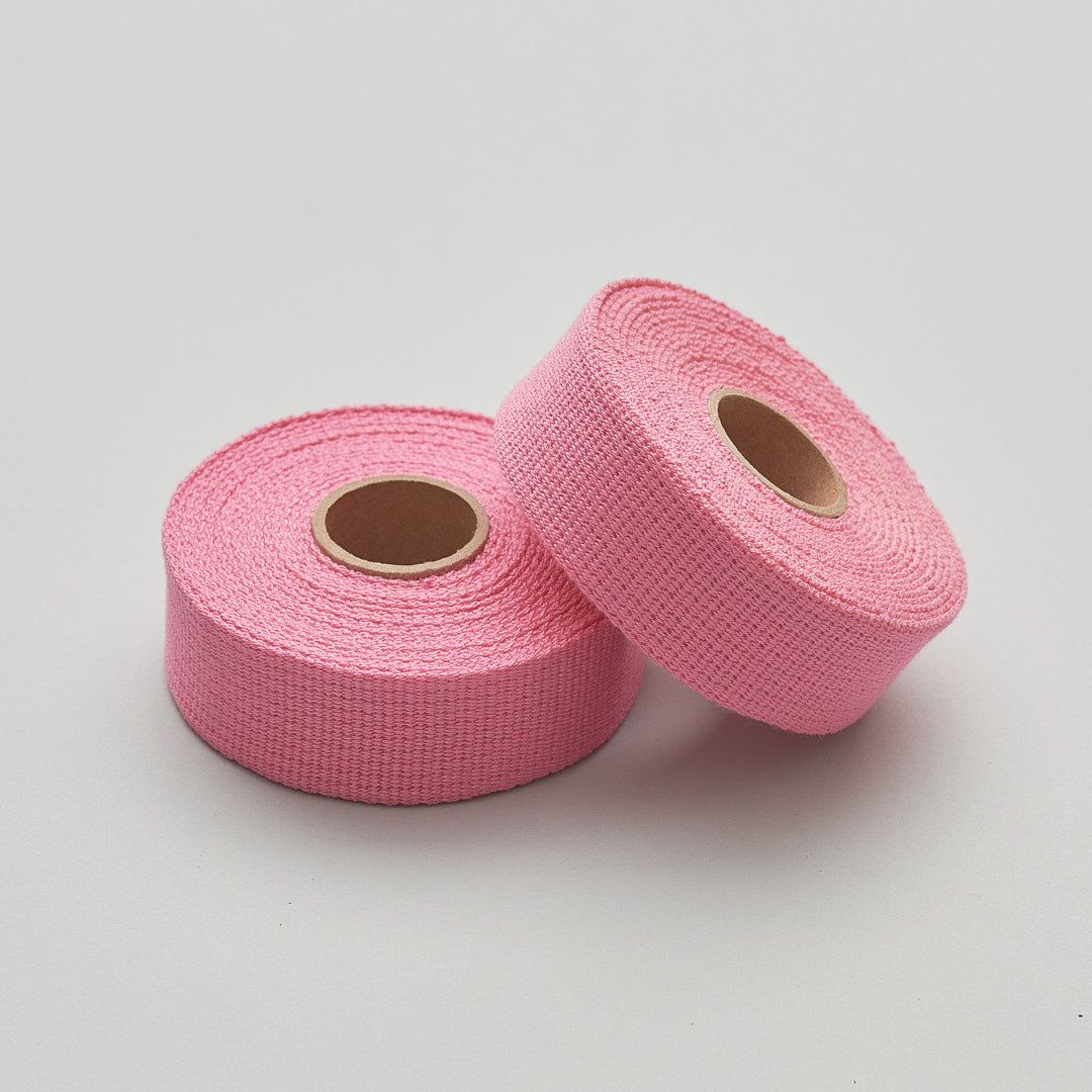 adhesive free woven handlebar tape for bicycles in pink